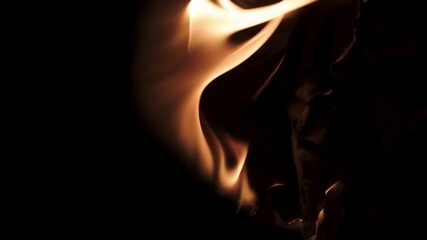 Burning paper, glowing edge of paper on a black background. Mockup for your logo. Wide angle horizontal wallpaper or web banner. flame effects for overlay designs or screen blending mode to make high.