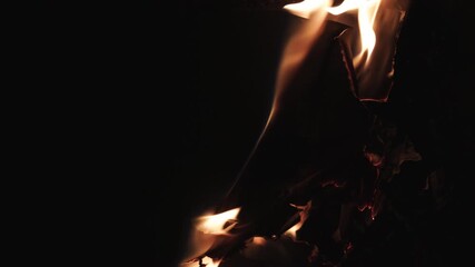 Burning paper, glowing edge of paper on a black background. Mockup for your logo. Wide angle horizontal wallpaper or web banner. flame effects for overlay designs or screen blending mode to make high.
