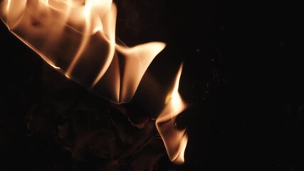 Burning paper, glowing edge of paper on a black background. Mockup for your logo. Wide angle horizontal wallpaper or web banner. flame effects for overlay designs or screen blending mode to make high.
