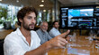 © Milos - An engaging corporate meeting where a participant presents, reflecting the integration of innovation and strategy in a modern business environment, fostering collaboration.