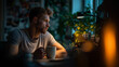 © Muhammad - Man drinking coffee late at night working from home office thoughtful pondering ideas