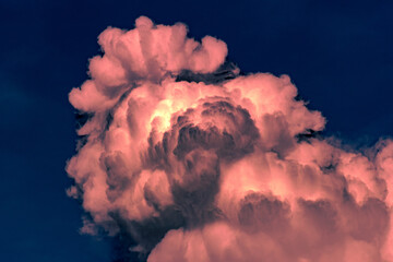 Wall Mural - Clouds in the blue sky before a thunderstorm. Toned.