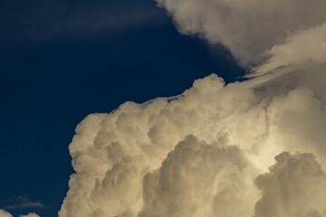 Wall Mural - Clouds in the blue sky before a thunderstorm. Toned.