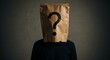 © hause - Person with question mark on paper bag head mystery concept