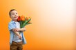 © BillionPhotos.com - Child with beautiful bouquet of tulips. Women's Day.