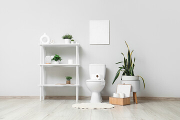 Wall Mural - Interior of light restroom with toilet bowl, shelf unit and plants
