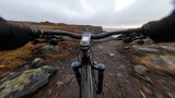 Coastal terrain cycling, rocky path adventure, mountain biking experience, thrill of the ride