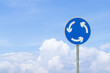 © Thepporn - Roundabout white, blue sign circle shape with blue sky cloud white is background. Signage warning traffic rules of people walking along city street to avoid moving car. Road safety traffic concept.