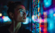 © Anisah - Young woman analyzing colorful illuminated digital data visualization with futuristic technology and artificial intelligence concept in dark room