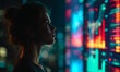 © Anisah - Young woman analyzing colorful illuminated digital data visualization with futuristic technology and artificial intelligence concept in dark room