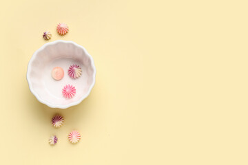 Wall Mural - Form for baking with sweet meringue on light yellow background