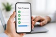 © Chanoknan - Progress Tracking on Mobile Device Displaying Tasks Completed with Checkmarks and Blue Progress Bar