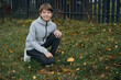 © Yulia Raneva - teenage boy found an edible mushroom in the garden