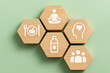 © sohel - Wooden hexagons representing pillars of health and wellness
