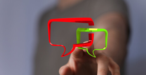 Man pointing at speech bubbles in red and green colors. Communication concept, networking idea. Technology connection.