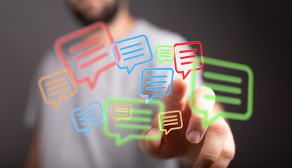A person interacts with glowing message icons, signifying digital communication and modern connection in a business context, highlighting techno