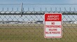© Atelier d’Alya - Airport Property No Trespassing Sign on Chain Link Fence