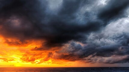 Wall Mural - Dramatic sunset over the ocean with dark clouds, creating a striking contrast and moody atmosphere
