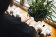 © sav_an_dreas - The hand of a woman checks the heat by touching an old central heating radiator.