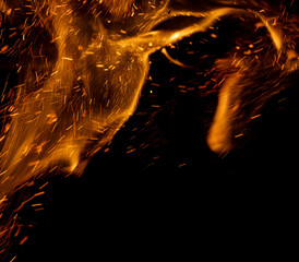 Wall Mural - A black background with a lot of orange sparks