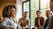 © Alice E - A group of diverse individuals engaged in a lively conversation in a cozy, well-lit room. A smiling woman with curly hair is the focal point, interacting with her colleagues or friends.