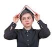 © 1STunningART - Fatigue student woman, dissatisfied expression, feels tired of constant learning, keeps a book on head, demands holidays. Difficult homework to solve. Anxiety and headache feeling as studying