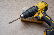 © vadish - Cordless drill driver with a complete set of drill bits and screwdriver bits in a sturdy case. Versatile power tool for drilling and fastening.