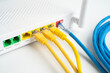 © Warawan - Ethernet cable with wireless router connect to internet service provider network.