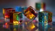 © orang - Colorful glass cubes shimmer atop a reflective surface