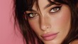 © Tina - Close-up portrait of a young woman with long dark hair and striking green eyes. She has a soft pink lip color and a subtle makeup look against a pink background.