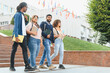 © Serhii - Diverse students walking on university campus together