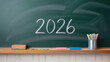 © Art_spiral - The year 2026 written in chalk on a green chalkboard with colorful markers and an eraser on the ledge