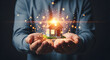 © Muh - Hands Holding Illuminated House with Glowing Light Sparks, Conceptual Representation of Real Estate and Homeownership