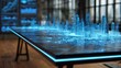 © mochalfin - Futuristic city model displayed on table in a modern office environment