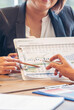 © aFotostock - Vertical Horizon Close up hands group of Business People meeting in conference room pointing financial document. Vertical business team brainstorming partner teamwork. Close up hand team meeting