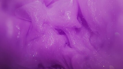 Wall Mural - Paint vapor. Splash art. Defocused purple lilac color ink shiny texture glitter liquid floating on abstract creative bokeh background.