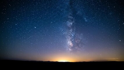 Wall Mural - night sky full of stars gradually fades to a bright morning, showcasing a celestial dawn as the sun 