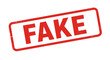 © Lsg 21 - Distressed red stamp label featuring the word fake evoking authenticity concerns warning deception unreliable information isolated on white background