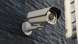 © tu - CCTV camera device attached to rough exterior wall, advanced monitoring and surveillance technology ensuring security, protection, and motion tracking for residential and commercial buildings.