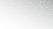 © Volha - Snowflakes falling softly on a white background in winter
