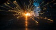 © Satriyo - Close-up of an industrial welding process with bright yellow sparks flying from molten metal on a dark steel surface in a workshop