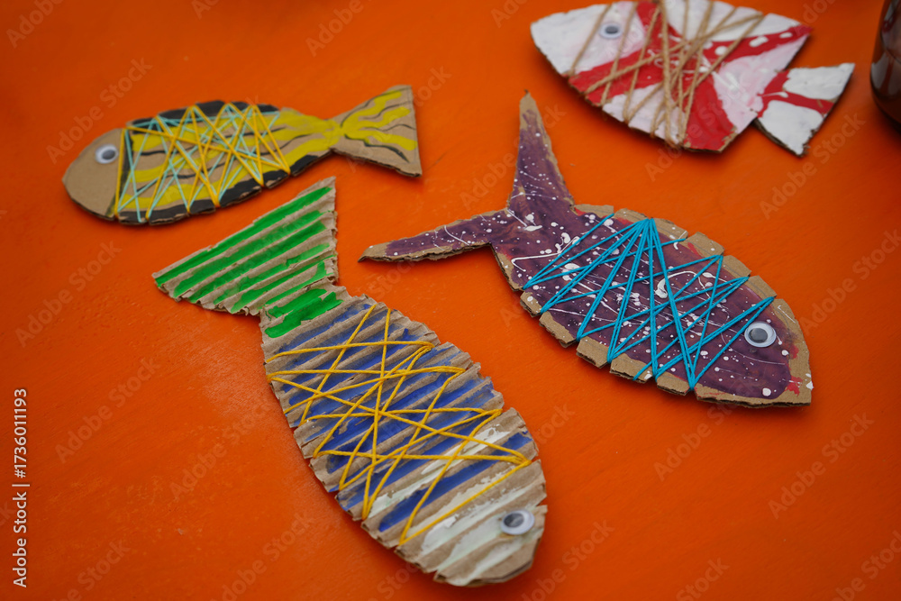 Make a cardboard fish using thread and paint, with detailed ...
