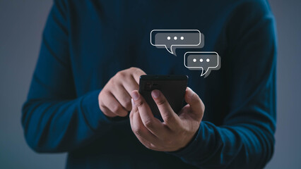 Close up of man using smartphone with chat message icons, concept of online communication, mobile messaging, digital technology, social networking, instant chat apps, and modern lifestyle connection.