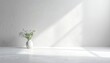 © sasa - Floral Arrangement in White Vase Under Sunlight Against a White Wall With Glitter