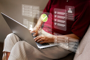 Wall Mural - Person hands using laptop keyboard completing digital forms online checklists task management modern business process remote work solution data entry efficiency
