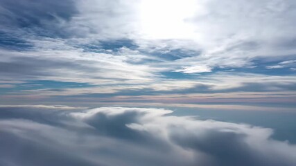 Wall Mural - Multiple layers of clouds slowly drift, forming intricate patterns against a vast, evolving sky wide shot, blue, atmospheric