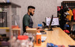 © PintoArt - Bicycle shop owner working at point of sale computer