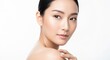 © PP Creative - Portrait of a beautiful young asian woman with flawless skin and gentle expression, looking sideways with a soft touch on her shoulder