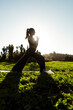 © ADDICTIVE STOCK - Woman practicing yoga outdoors in autumn in New Zealand