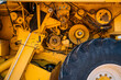 © ADDICTIVE STOCK - Close up view of machinery parts in a yellow tractor